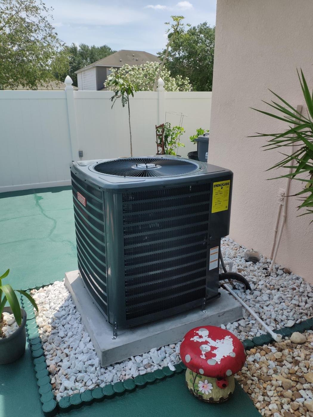 AC installation in Columbia TN — Goodman condenser by a fence