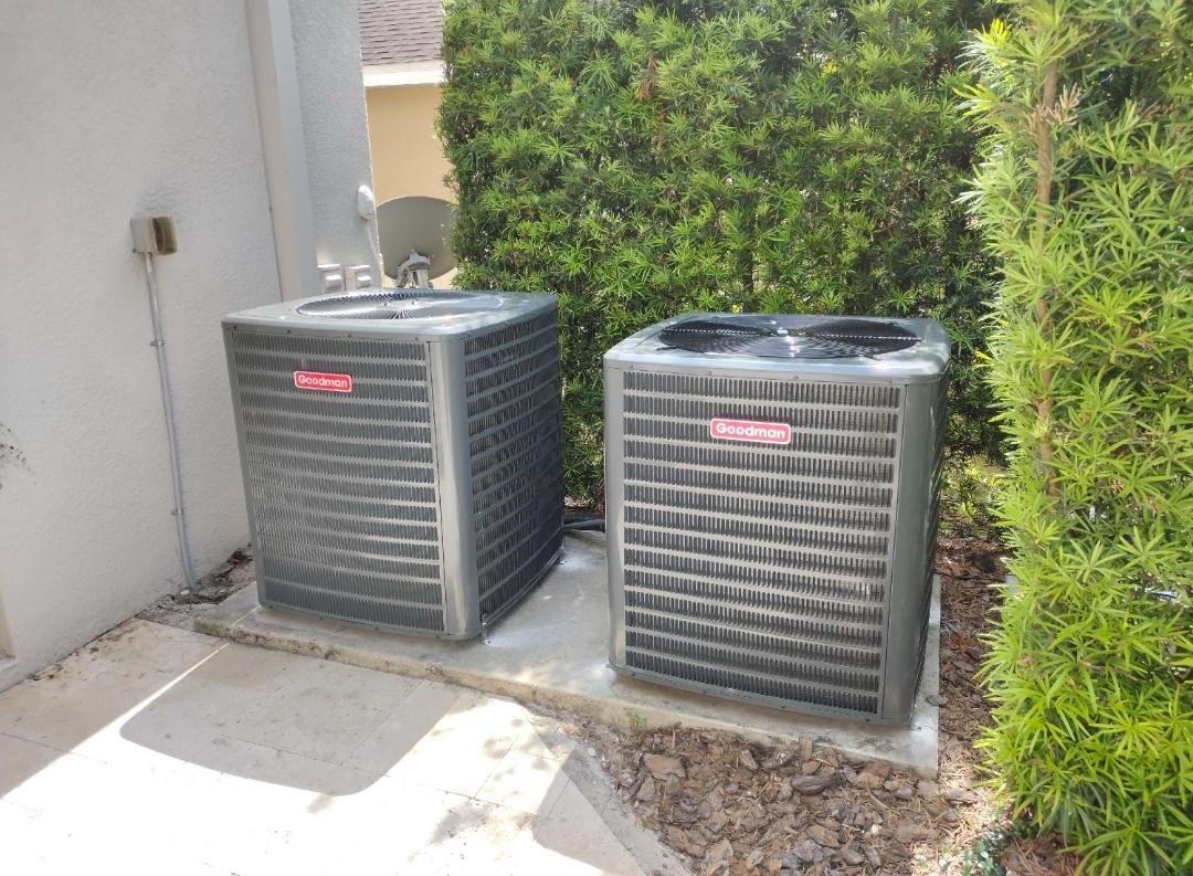 AC installation in Spring Hill TN — two Goodman condensers on a pad