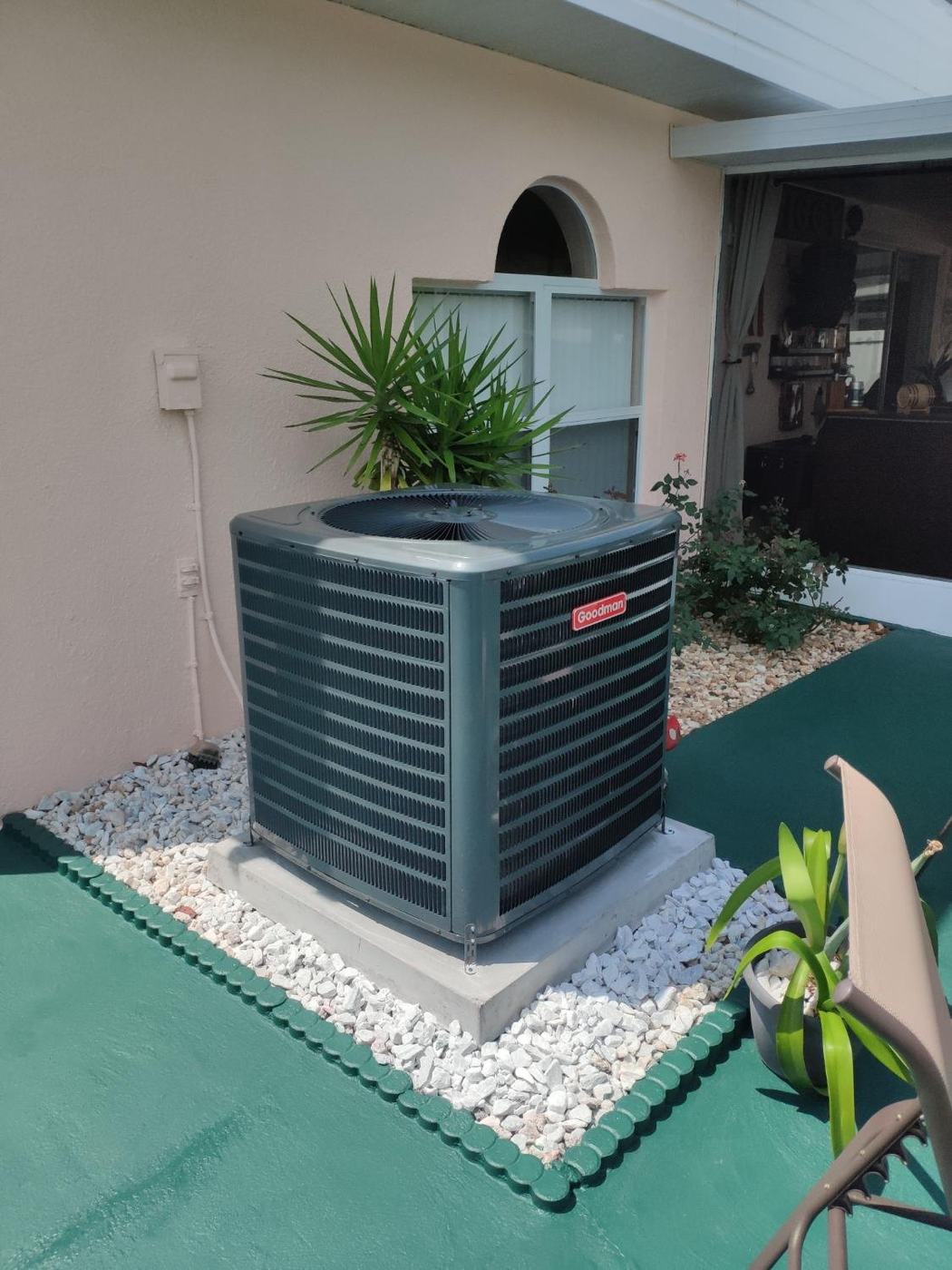 AC installation in Spring Hill TN — Goodman condenser on a patio pad