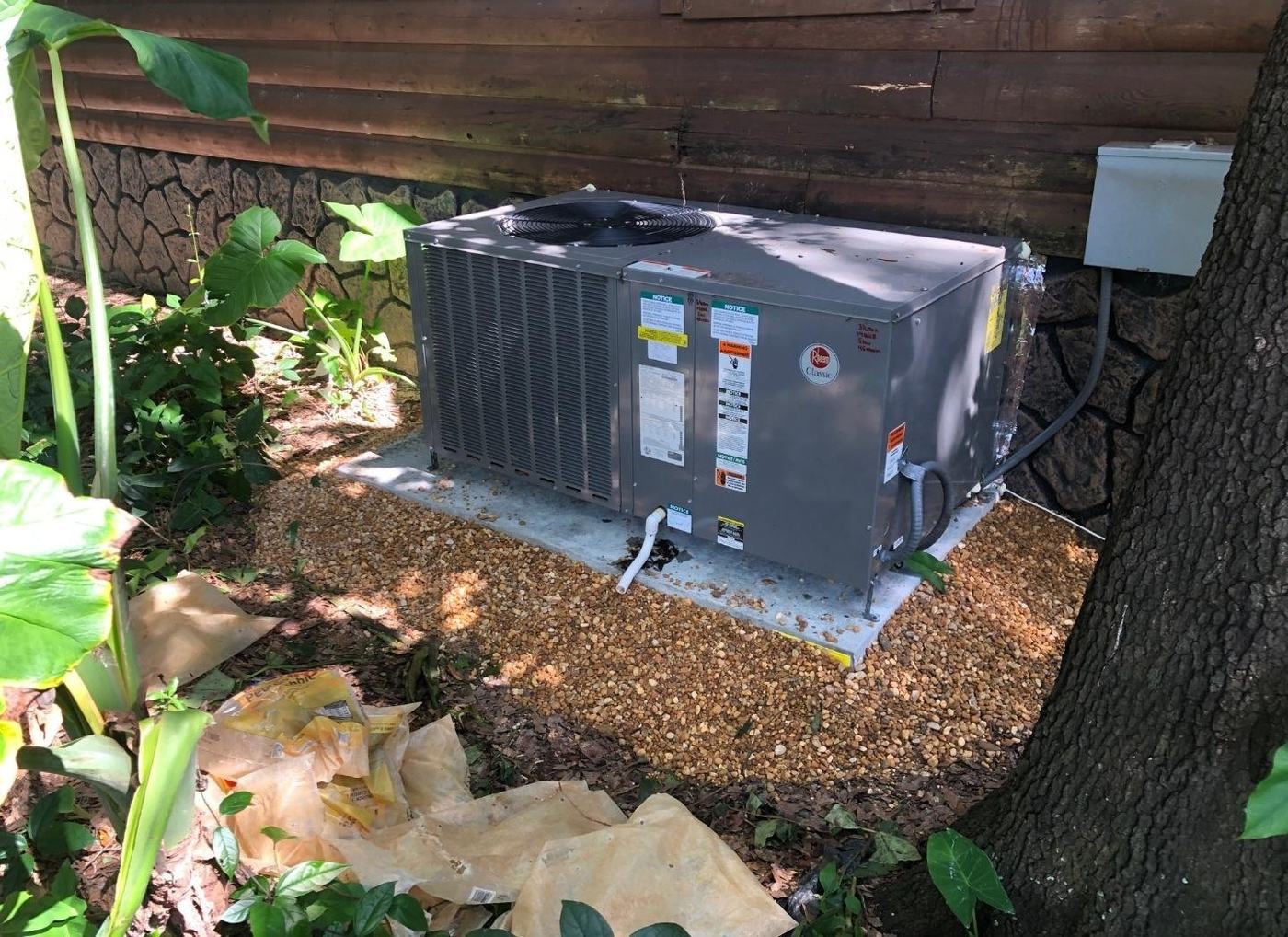 AC installation in Spring Hill TN — Rheem package on a pad
